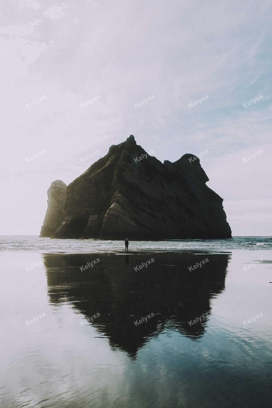 Lone Figure Before Sea Stack