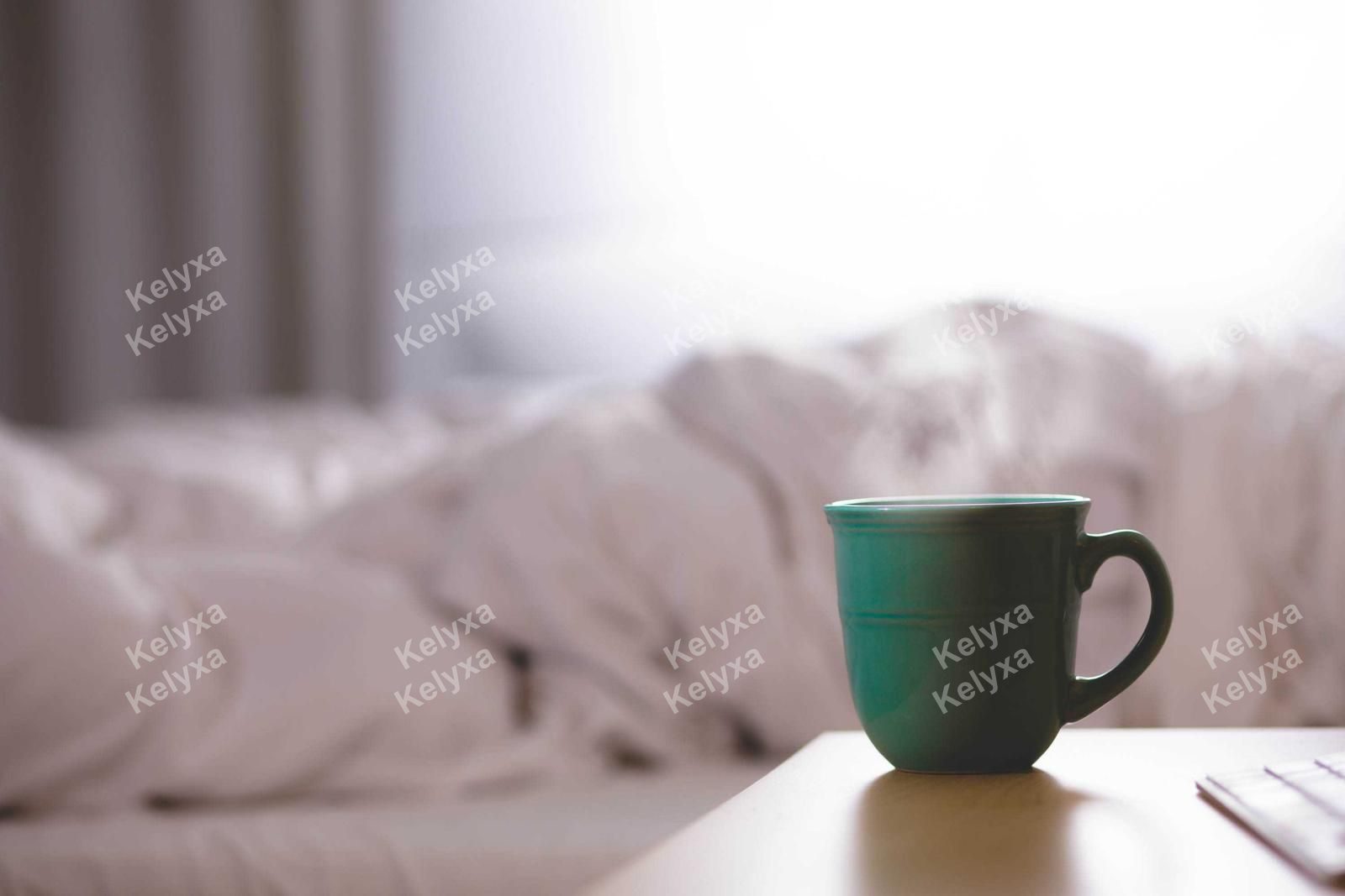 Steaming Green Mug on Bedside Table