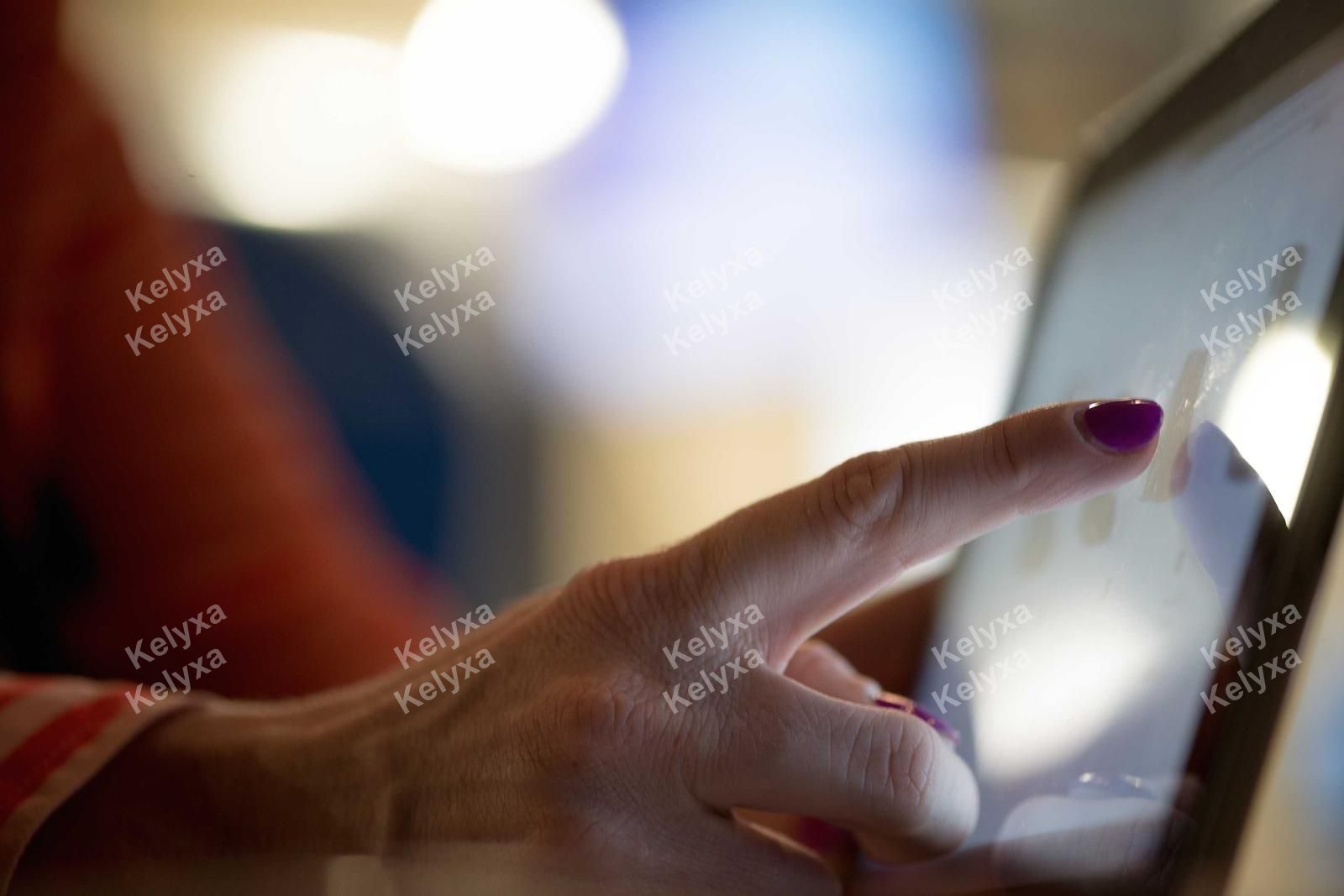 Finger Tapping Glowing Tablet Screen
