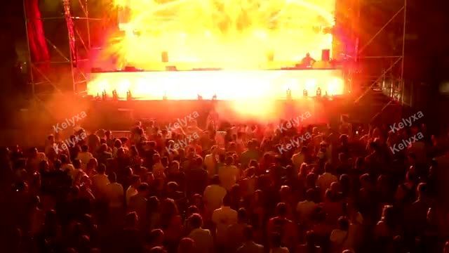 Crowd Cheering at Fiery Concert Stage