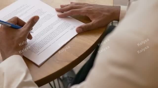 Signing Documents at Desk